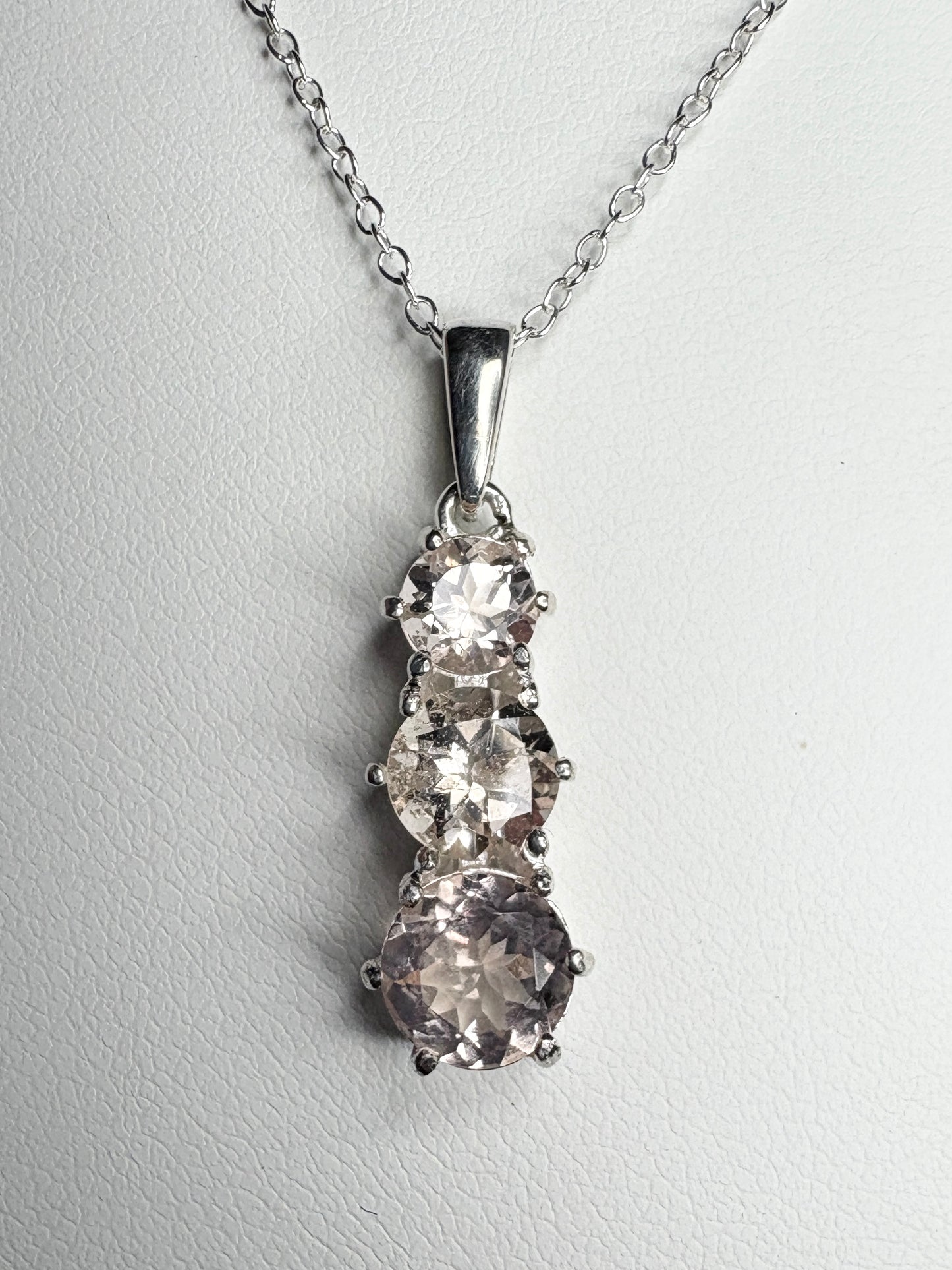 Sterling silver pendant necklace with three natural morganite stones.