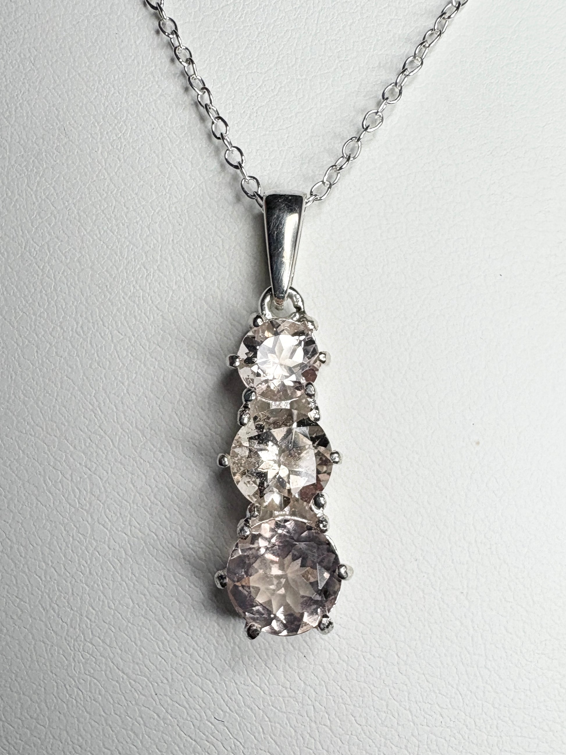 Sterling silver pendant necklace with three natural morganite stones.
