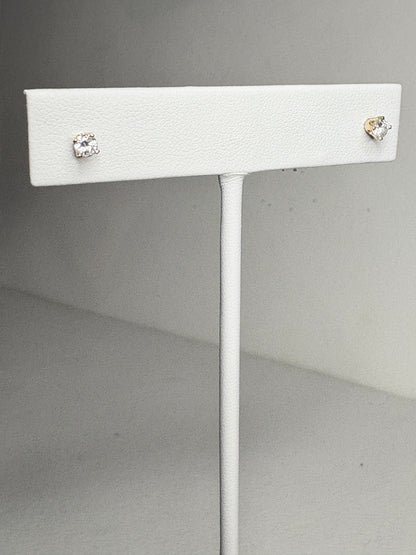 Natural diamond solitaire stud earrings in solid 14k gold.