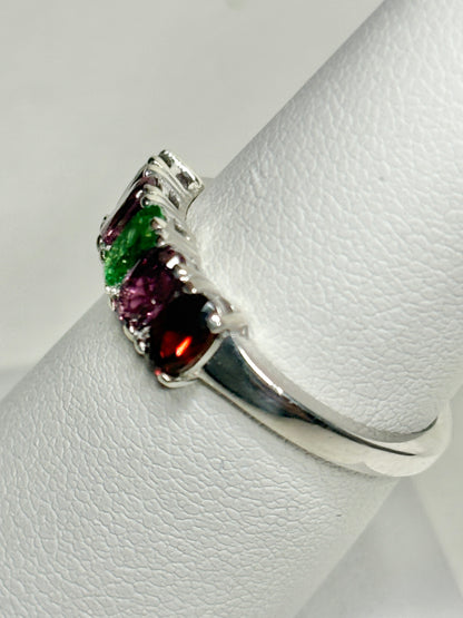 Sterling silver ring with almandine, rhodolite, and tsavorite garnets.