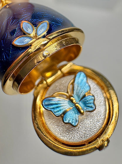 Opens. Silver. Gold Plated Blue Egg Locket with Butterfly Surprise. Diamond.