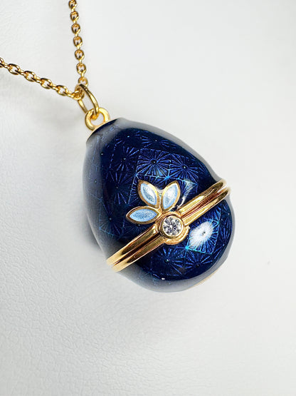 Opens. Silver. Gold Plated Blue Egg Locket with Butterfly Surprise. Diamond.