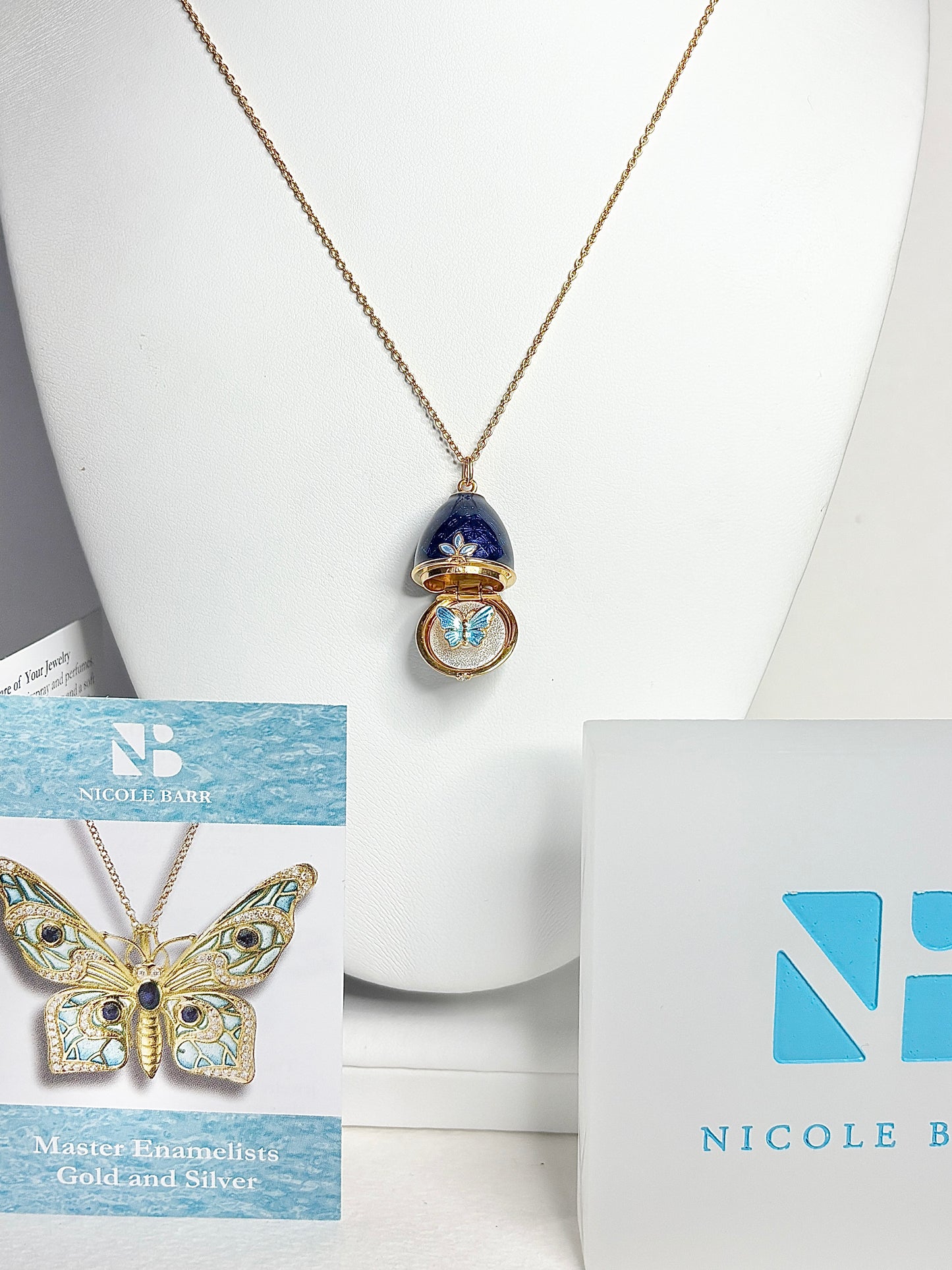 Opens. Silver. Gold Plated Blue Egg Locket with Butterfly Surprise. Diamond.