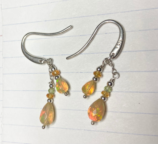 Sterling silver dangle earrings with Ethiopian opals, peridot, and spessartite garnets.