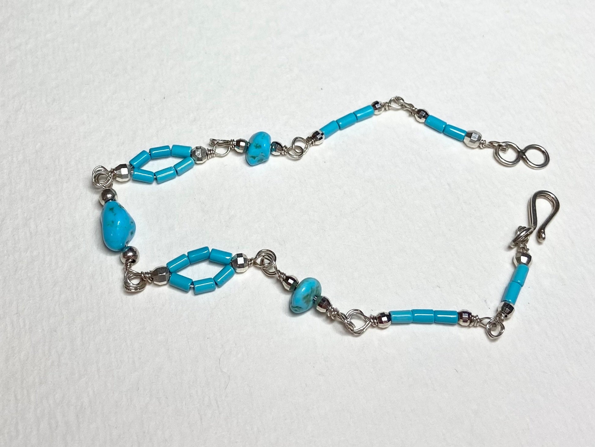Sterling silver bracelet with Sleeping Beauty turquoise nuggets and beads.