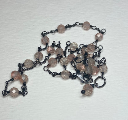 Adjustable sterling silver necklace with peach Oregon sunstone beads.