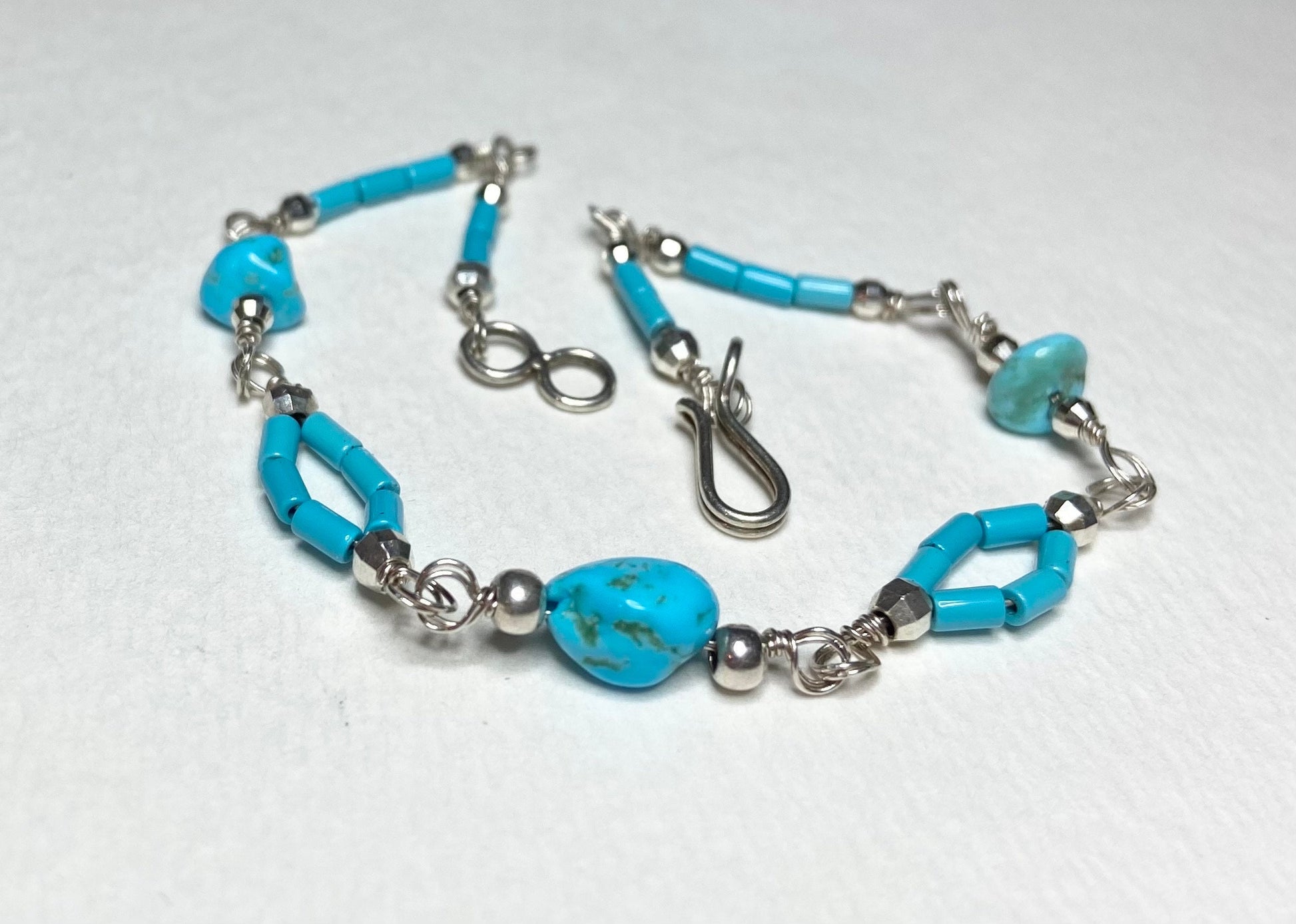 Sterling silver bracelet with Sleeping Beauty turquoise nuggets and beads.