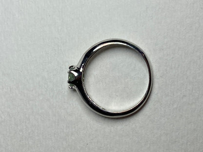 Sterling silver ring with a color-changing chrysoberyl solitaire.