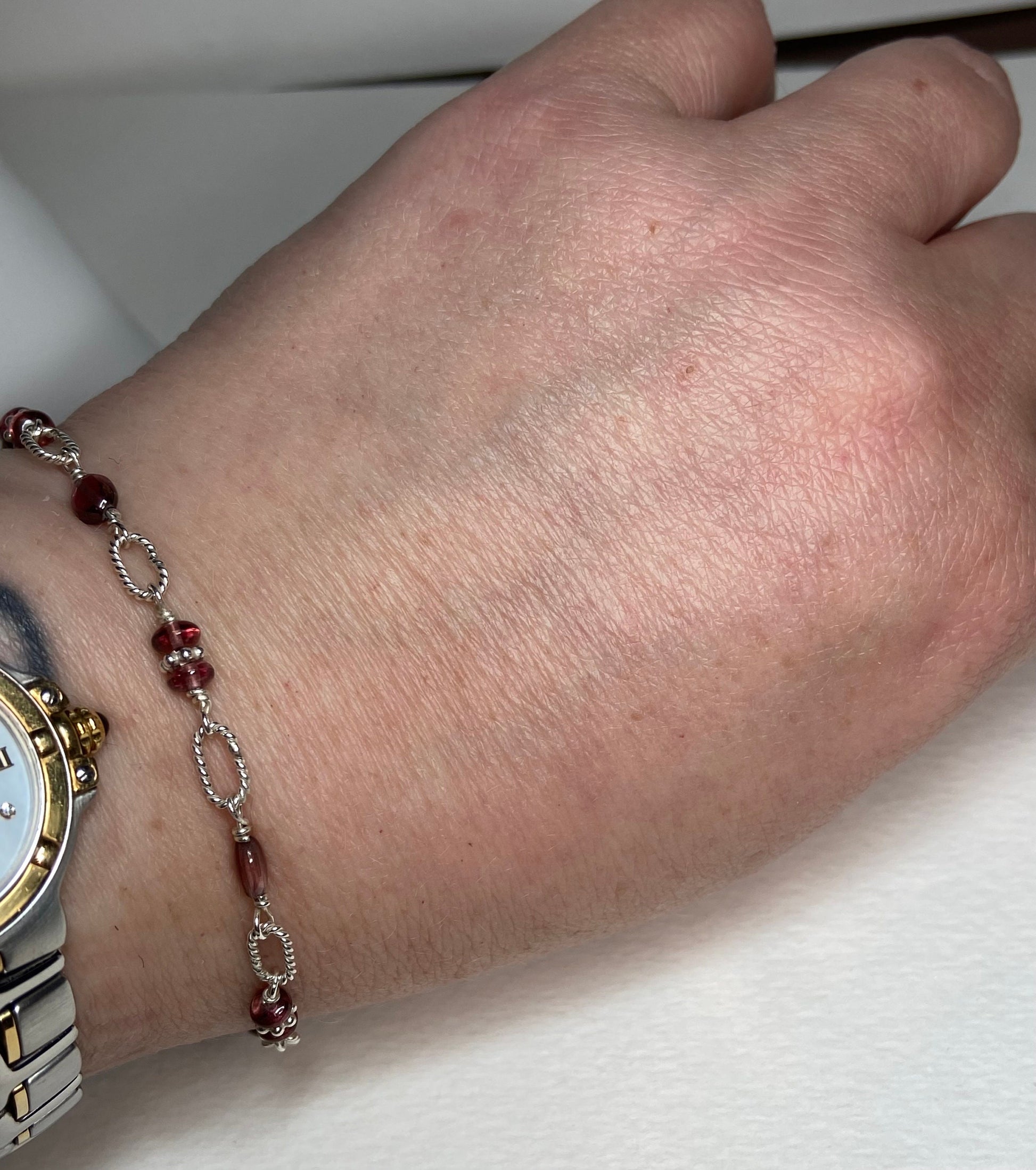 Malawi rhodolite garnet sterling silver beaded bracelet with a watch.