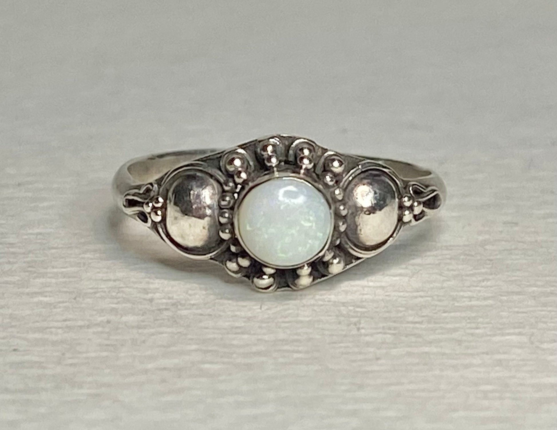 Handmade sterling silver ring with a round Australian opal.