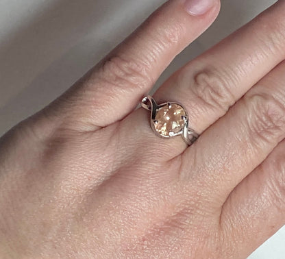 Peach Oregon Sunstone oval solitaire ring in sterling silver.