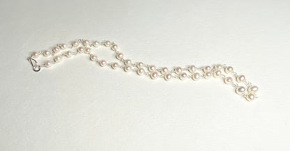 Lustrous genuine cultured freshwater pearl necklace in solid sterling silver.