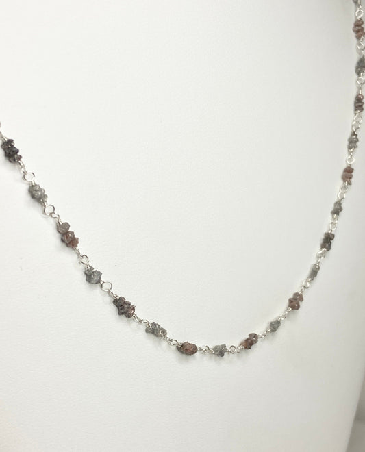 Sterling silver necklace with alternating rough natural silver and brown diamonds.