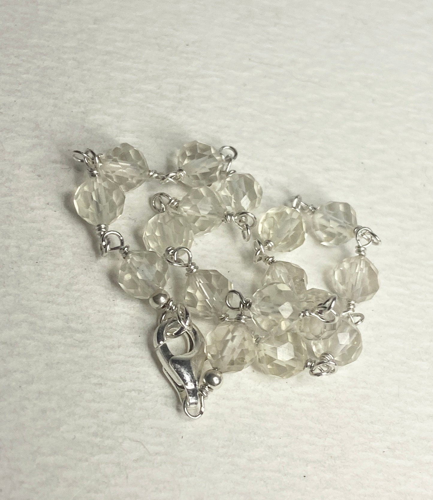 Sterling silver bracelet with faceted yellow sunstone beads and a lobster clasp.