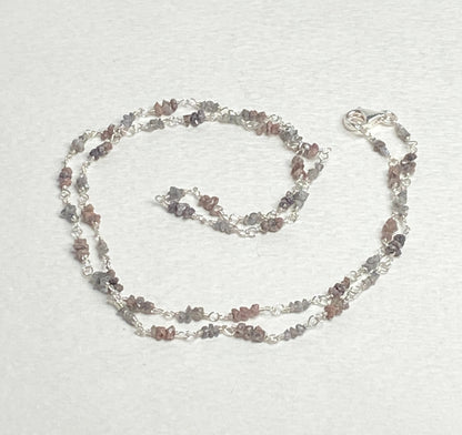 Sterling silver necklace with stations of rough natural silver and brown diamonds.