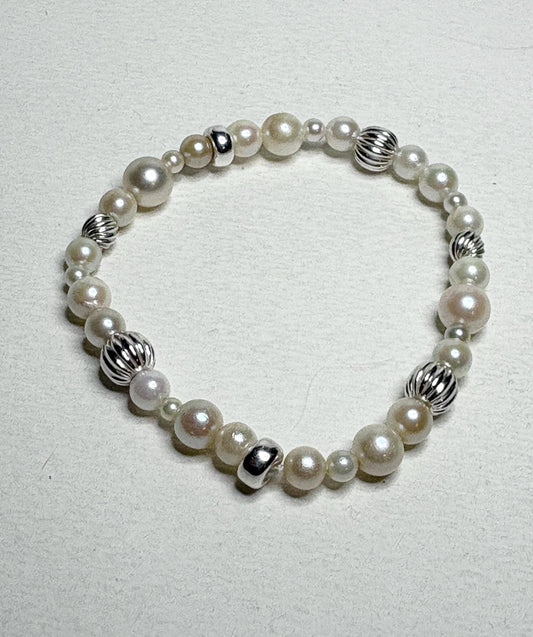 Vintage Akoya pearl stretch bracelet with sterling silver accents.