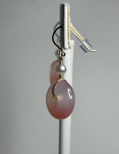 14k gold dangle earrings with pink ombre agate donuts and Akoya pearls.