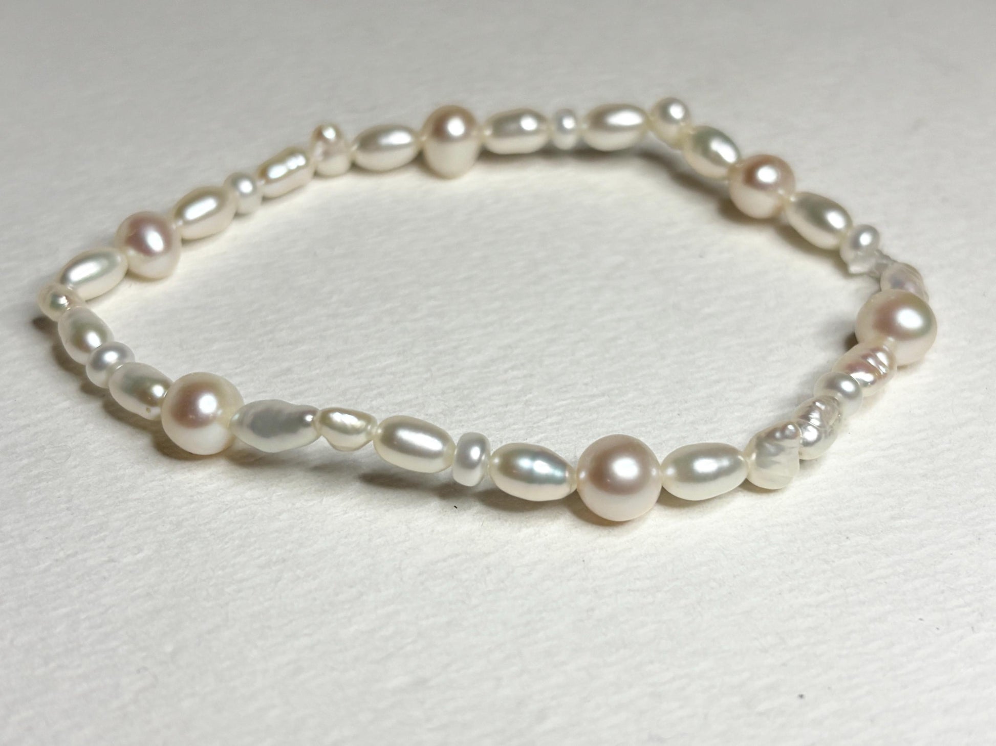 Freshwater cultured pearl rice and baroque stretch bracelet.