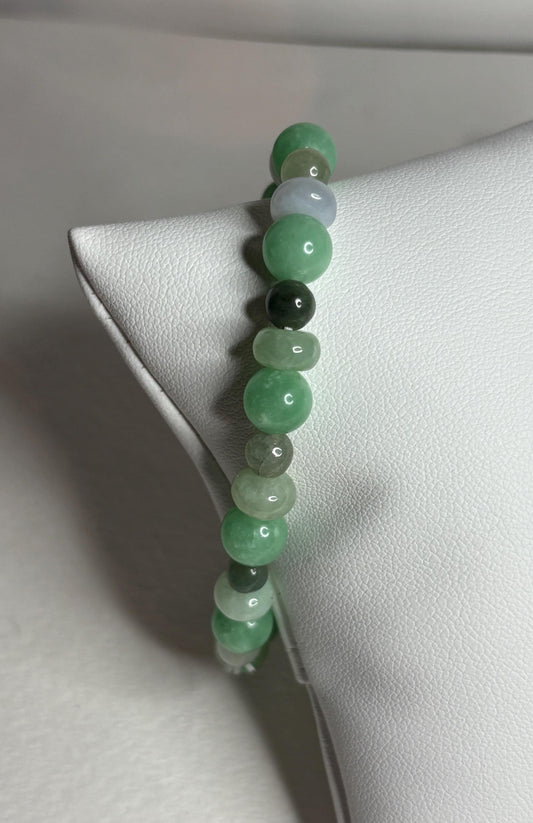 Burmese Type A jadeite jade stretch bracelet with mixed green beads.