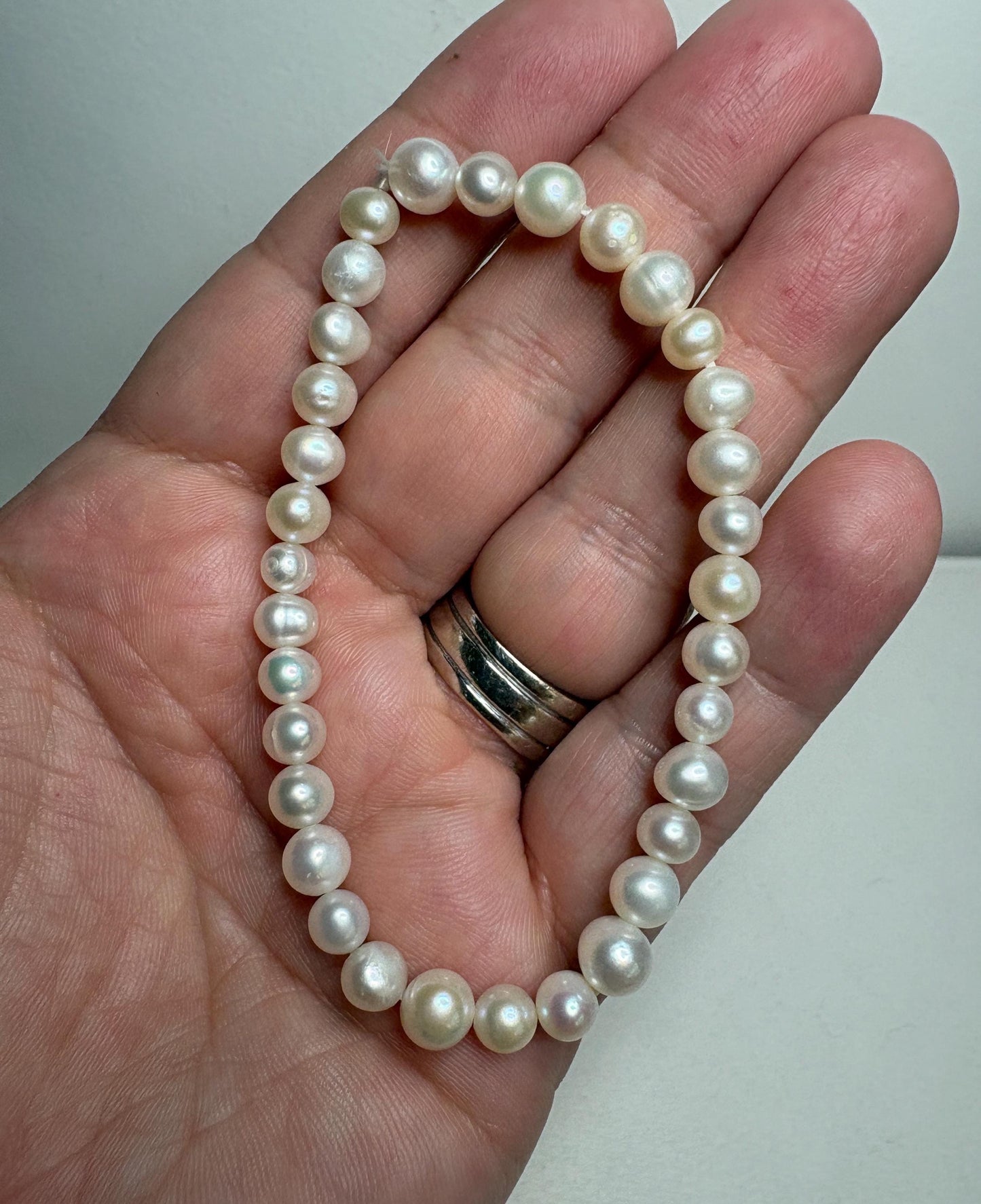 Freshwater cultured pearl stretch bracelet with baroque and potato-shaped pearls.