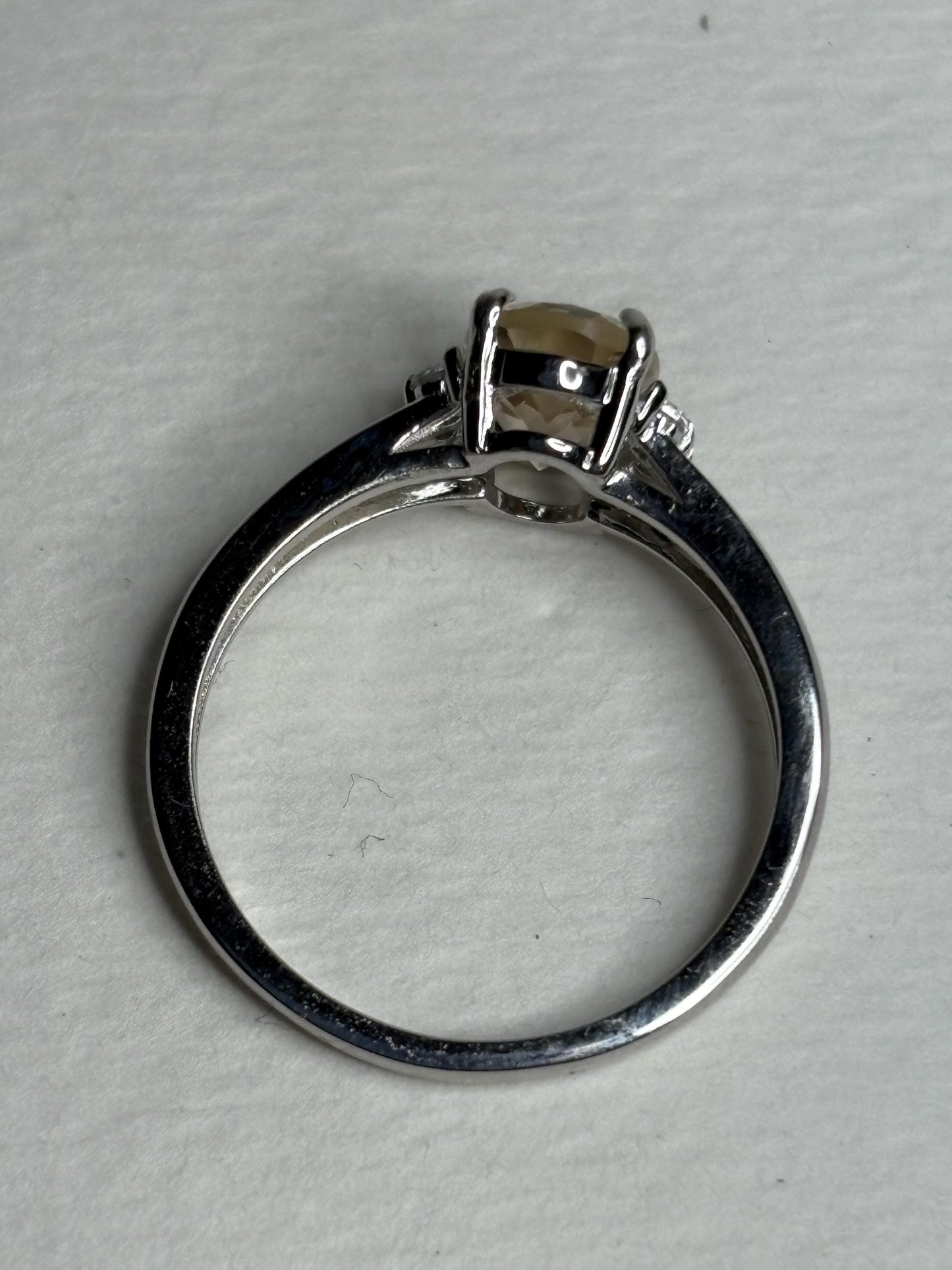 Sterling silver ring with an oval Oregon sunstone and accent crystals.
