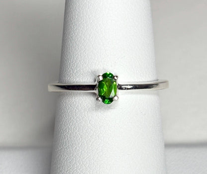 Sterling silver ring with a 3x5mm oval chrome diopside gemstone.