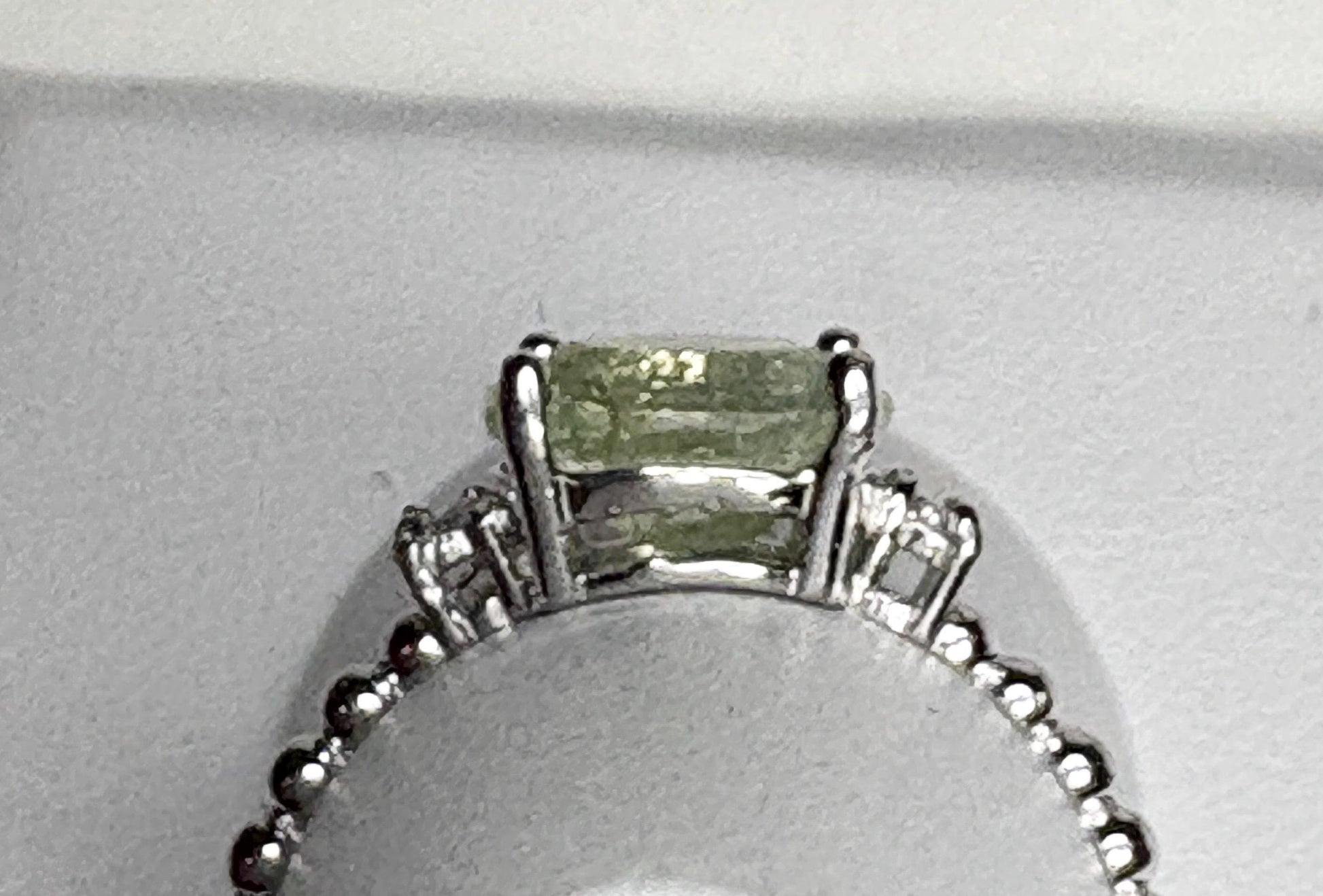 Sterling silver ring with a green tourmaline and diamonds.