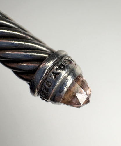 Sterling silver cable cuff bracelet with a faceted morganite-colored gemstone.