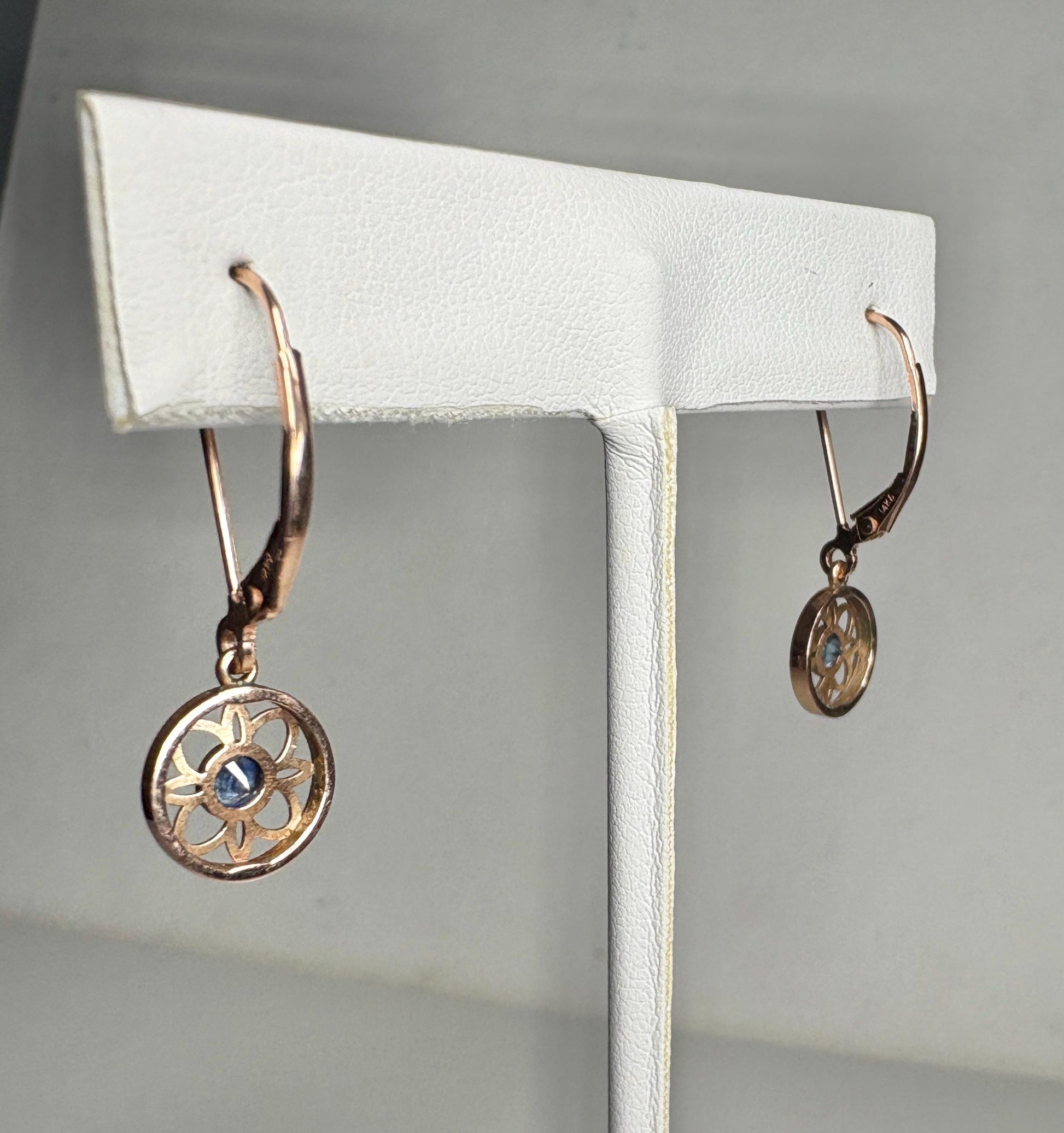Montana sapphire dangle drop earrings in solid 14k rose gold with lever backs.