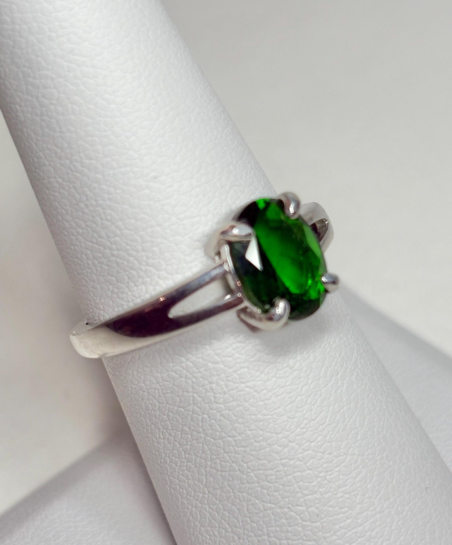 Sterling silver ring with an oval chrome diopside gemstone.