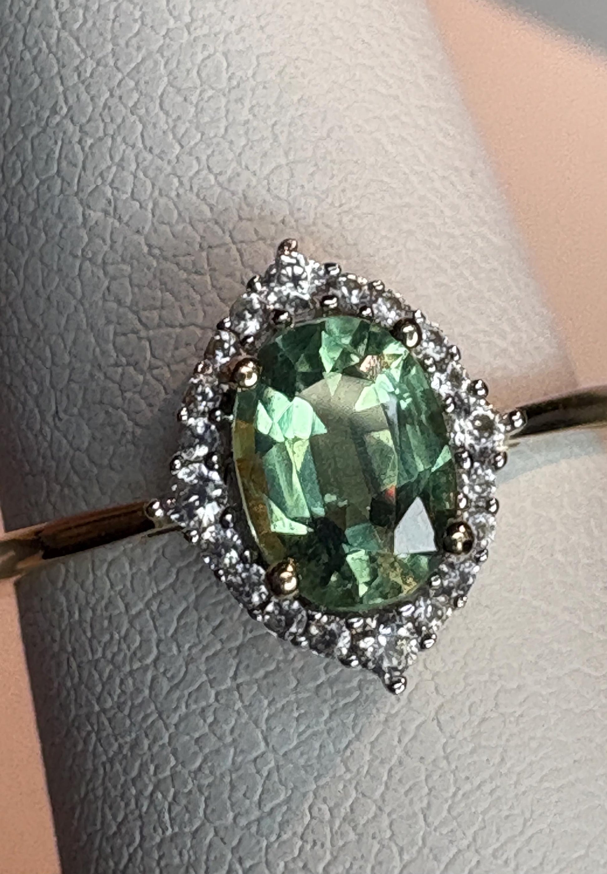 Mint green kyanite and zircon halo ring in solid 9k gold.