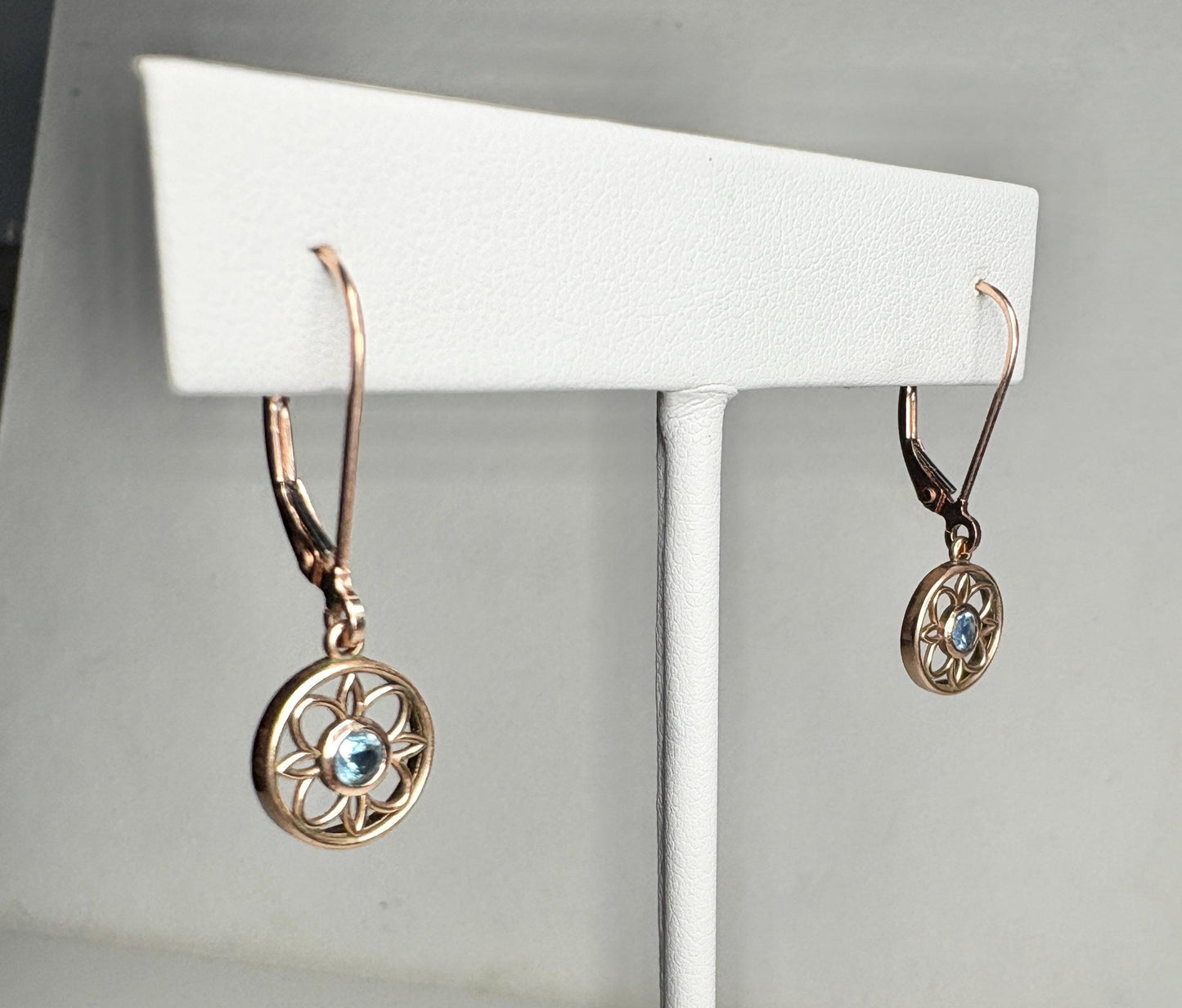 Montana sapphire dangle drop earrings in solid 14k rose gold with lever backs.