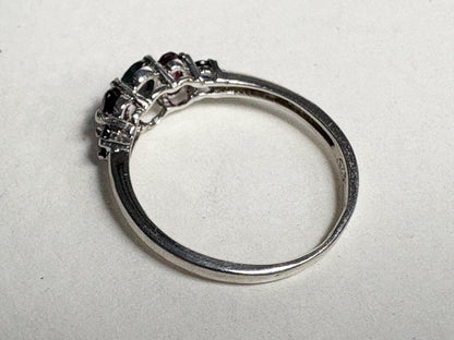 Sterling silver band ring with alexandrite, rhodolite garnets, and blue sapphires.