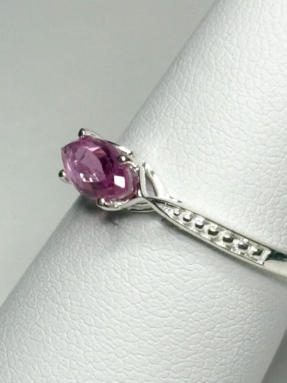 Sterling silver ring with a rose-cut, east-west set marquise pink sapphire.