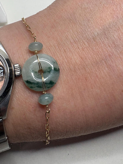 Burmese jadeite jade Type A Pi donut moss in snow bracelet in 14k gold.