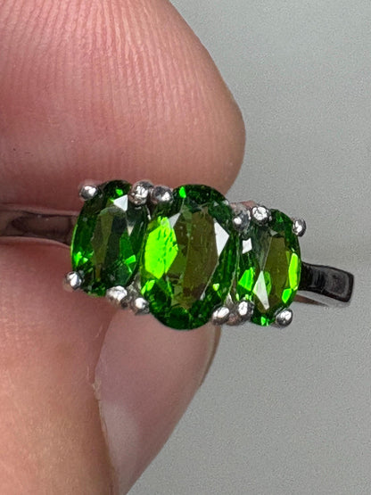 Sterling silver ring with three oval chrome diopside stones.