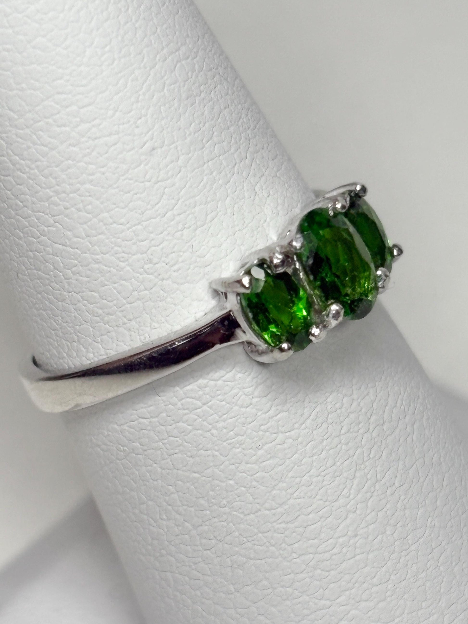 Sterling silver ring with three oval chrome diopside stones.