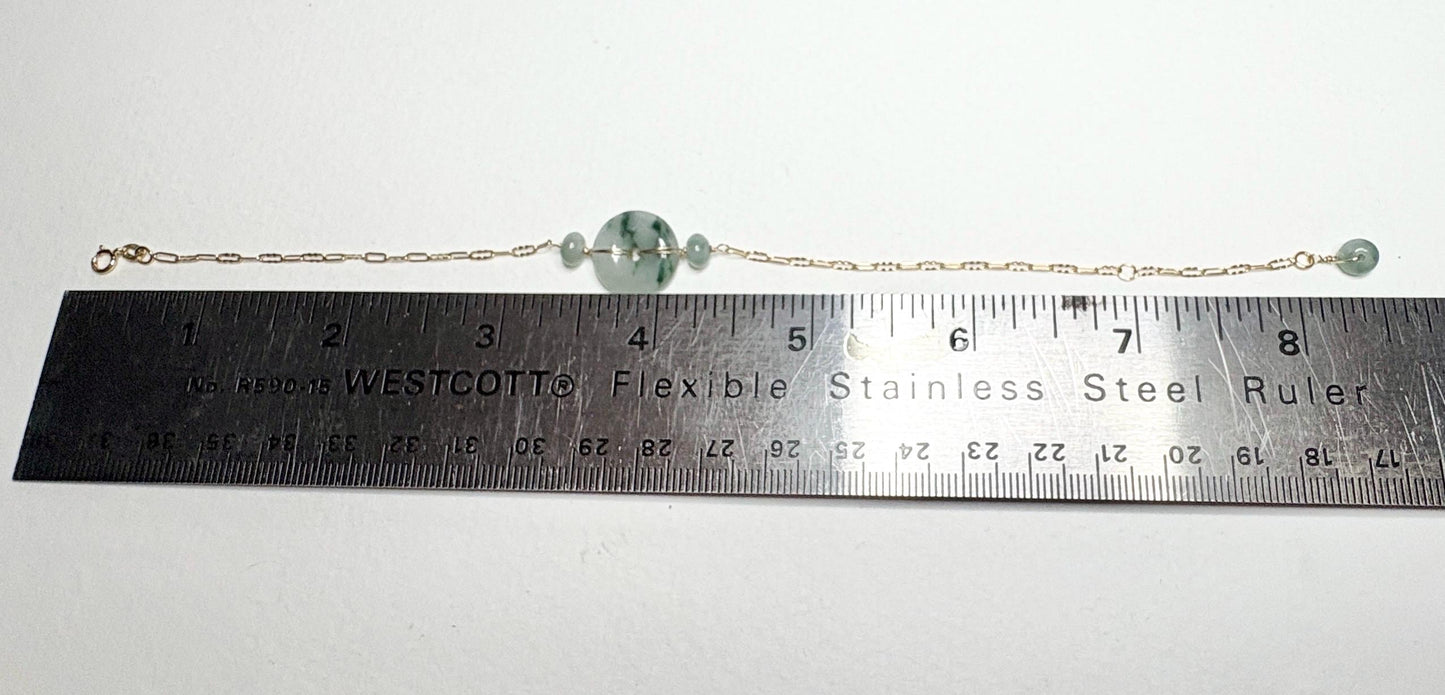 14k gold bracelet with Burmese jadeite jade "moss in snow" donut and beads.