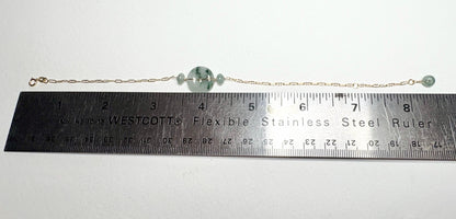 14k gold bracelet with Burmese jadeite jade "moss in snow" donut and beads.