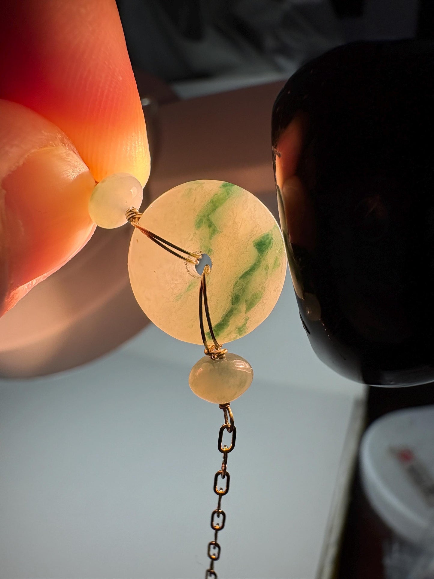Burmese jadeite jade Type A Pi donut bracelet with moss in snow pattern, set in 14k gold.