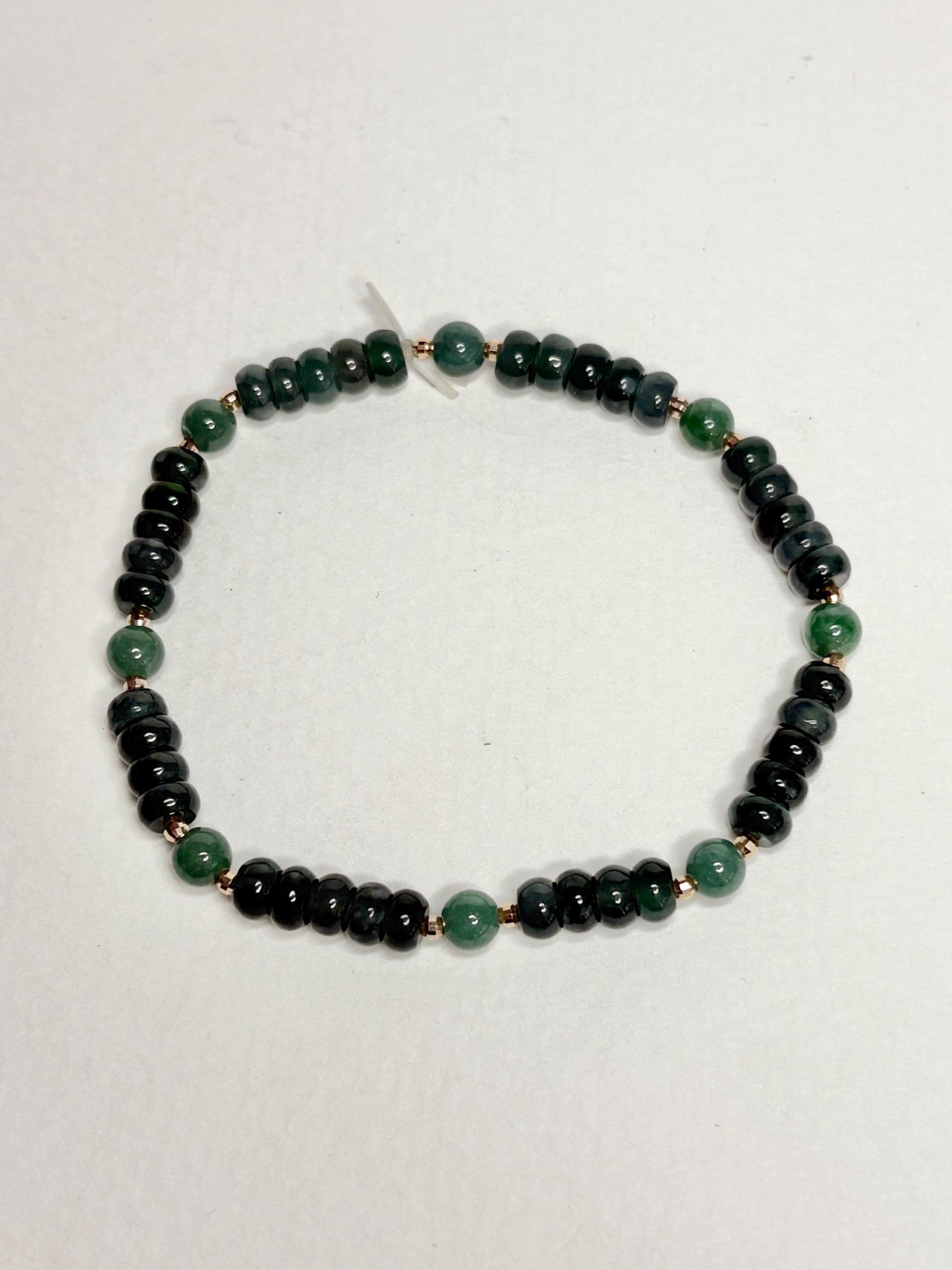Natural untreated Type A jadeite jade stretch bracelet with solid 14k gold beads.