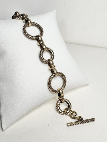 Vintage solid bronze adjustable link bracelet with toggle clasp.