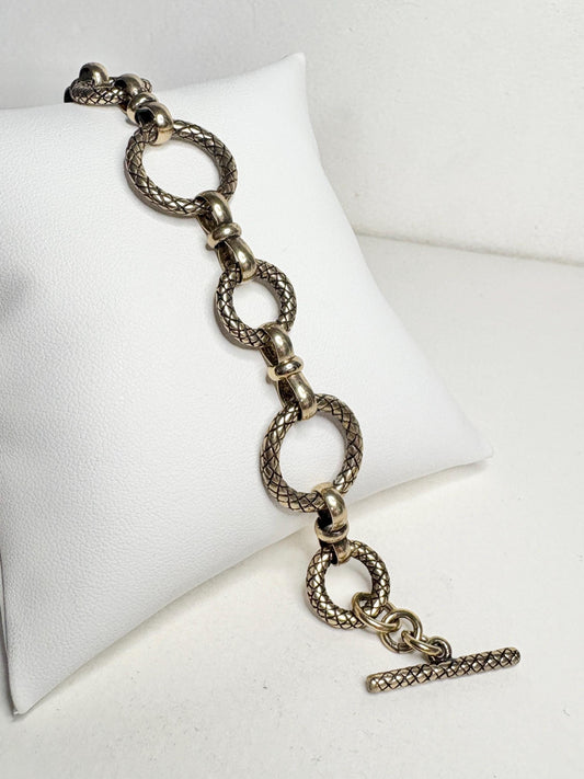 Vintage solid bronze adjustable link bracelet with toggle clasp.