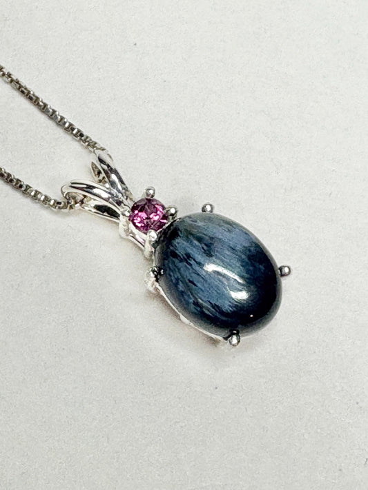 Sterling silver pendant necklace with oval blue pietersite and rhodolite garnet.