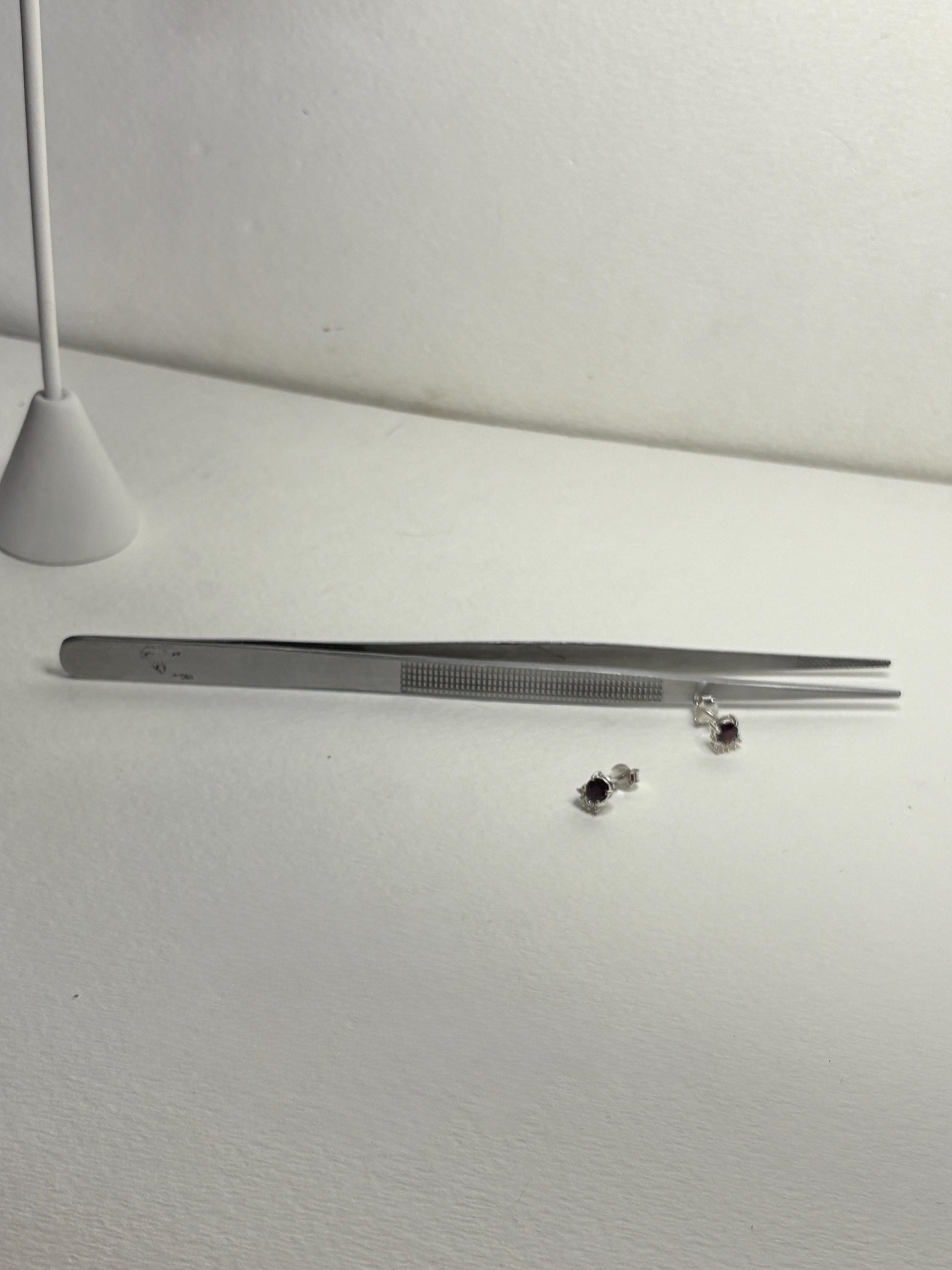 Sterling silver stud earrings with Arizona anthill garnets and zircons.