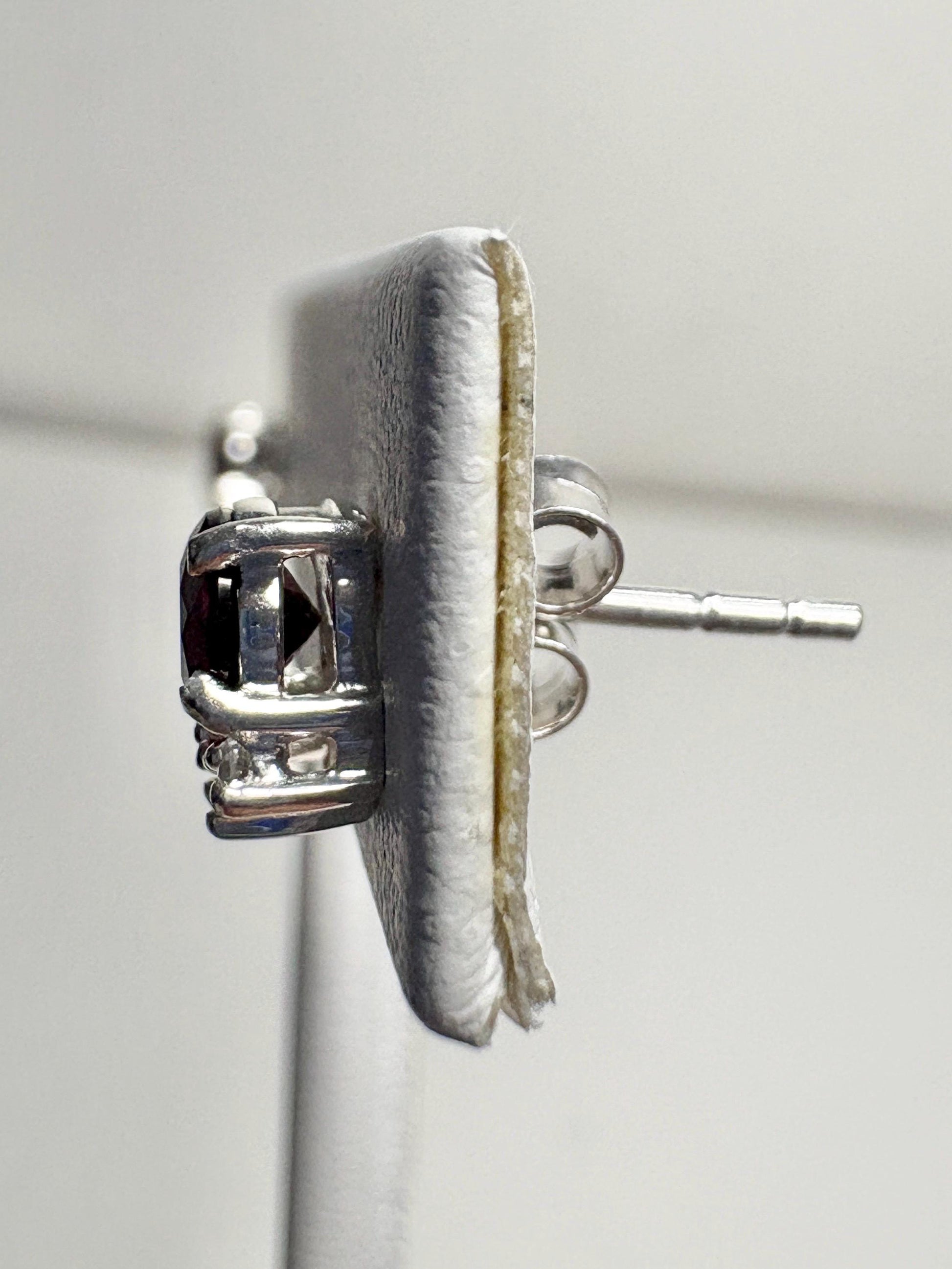 Sterling silver stud earrings featuring round Arizona anthill garnets and zircons.