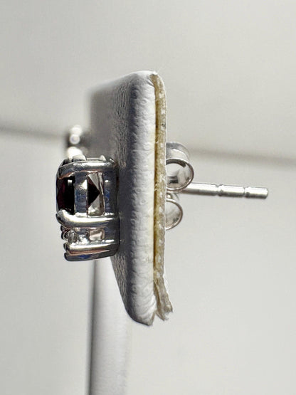 Sterling silver stud earrings featuring round Arizona anthill garnets and zircons.