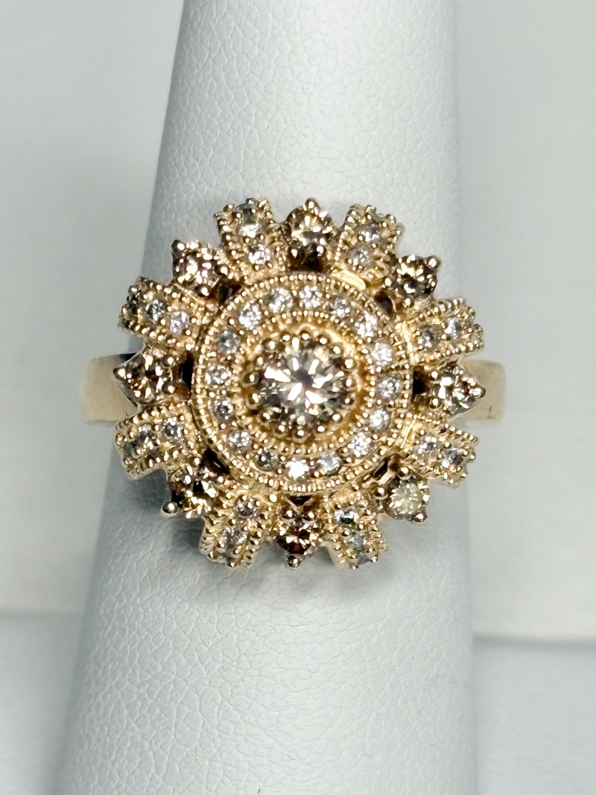 Bold 14k gold ring with champagne diamonds in a sunburst design.