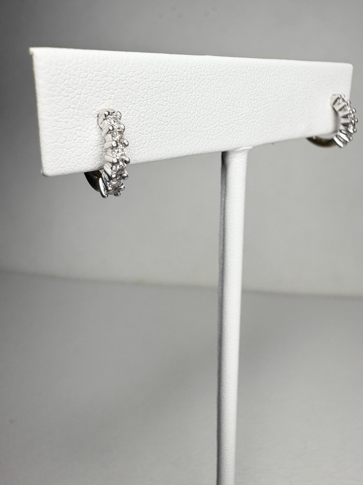 Tiny 14k gold hoop earrings with natural diamonds.