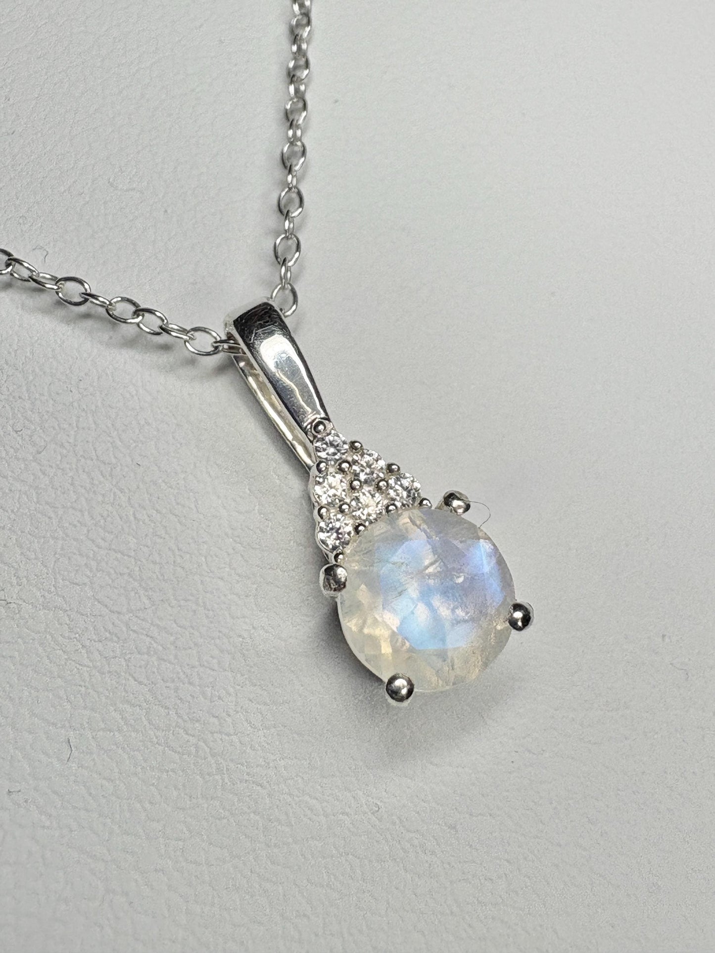 Sterling silver pendant necklace with rainbow moonstone and zircon.
